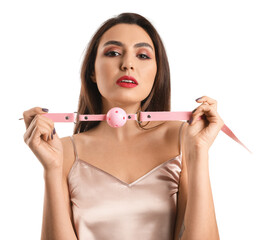 Young woman with mouth gag on white background - obrazy, fototapety, plakaty