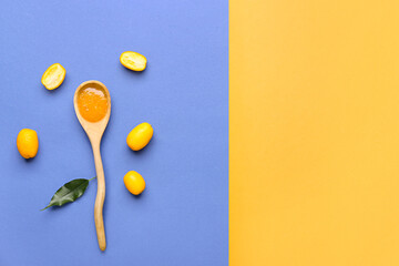 Spoon of tasty kumquat jam and fresh fruits on color background