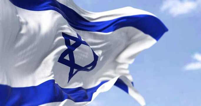 Detail of the national flag of Israel waving in the wind on a clear day