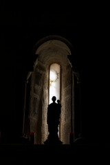 Fototapeta premium Church window with saint sculture