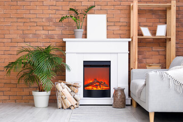 Interior of modern living room with mantelpiece, firewood and houseplants