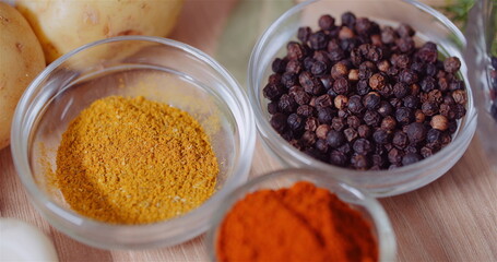 Spices In Bowls On Wooden Table