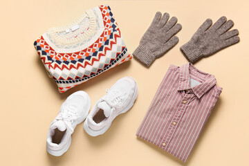 Stylish male clothes, gloves and shoes on color background