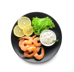 Plate of tasty boiled shrimp tails with lemon slices and sauce on white background
