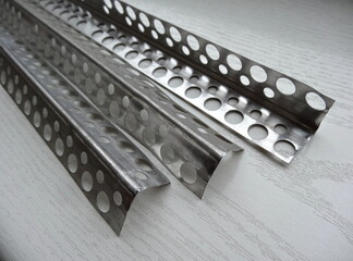 Perforated metal corner bead. Aluminum corner beads. Perforated external corner