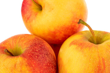 Three red juicy apples, macro, isolated on white.