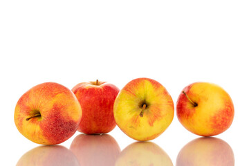 Four red juicy apples, macro, isolated on white.