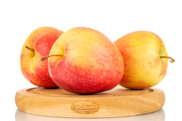 Three red juicy apples on a wooden tray, macro, isolated on white.