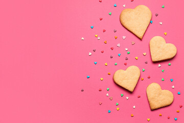 Tasty heart shaped cookies on pink background. Valentines Day celebration