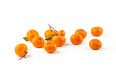 Ripe tangerines on the table on a white background.