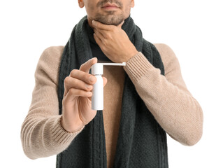 Ill young man with inhaler isolated on white