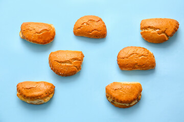 Tasty sochniki with cottage cheese on blue background