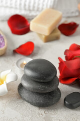 Fototapeta na wymiar Natural spa stones on beige background. Valentine's Day celebration