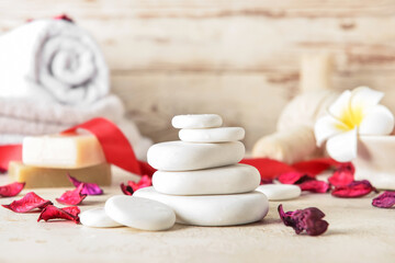 Fototapeta na wymiar Natural spa stones on table. Valentine's Day celebration