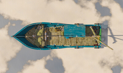 wood fishing boat is low tide on the desert after rain top view