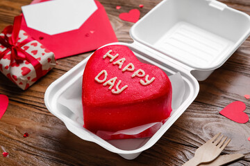 Plastic lunch box with tasty bento cake on wooden background, closeup