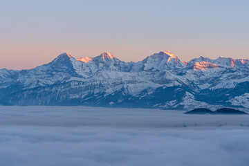 Swiss mountains evening with snow and fog