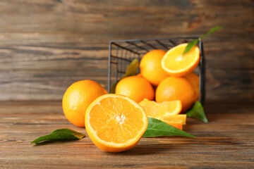 Fresh juicy oranges on wooden background