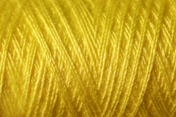 Yellow sewing threads as background