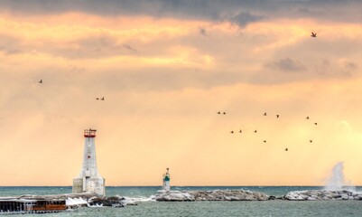 Cobourg lighthouse and pier in late afternoon sun Cobourg Ontario Canada