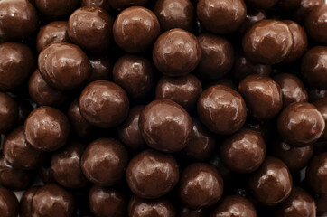 Chocolate milk balls. Background of a large number of brown chocolate balls