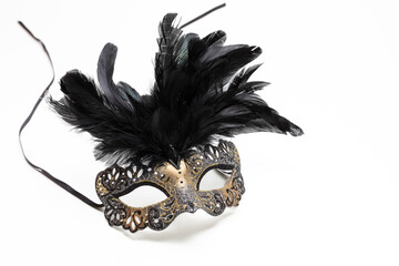 Carnival mask brown color with black feather decoration isolated on white background