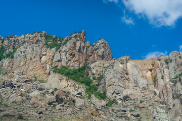 Fototapeta na wymiar Stonefalls formations in mountains 
