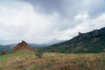 Fototapeta na wymiar View of Kara-dag volcano in a rainy day