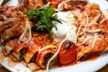 Barbecued Turkish beyti kebab with appetizer