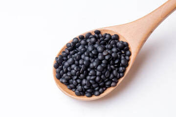 Black beluga lentils on the white background