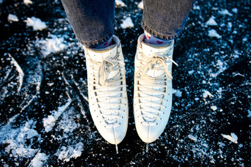 close-up of a girl in fashionable white skates. top view