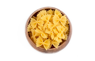 A variety of types and shapes of Italian pasta. Dry pasta bows farfalle. Heap of bow tie macaroni isolated on white background. Butterfly pasta.