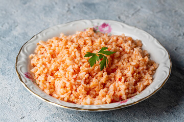 Traditional delicious Turkish food; rice pilaf with tomatoes (Turkish name; Domatesli pirinc pilavi)