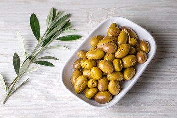 Cracked green olives. Cracked green olives with lemon. Turkish style olive (Turkish name; kirma zeytin)