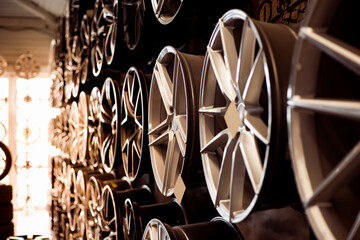 Car alloy wheels in a store, selective focus. Sale and replacement