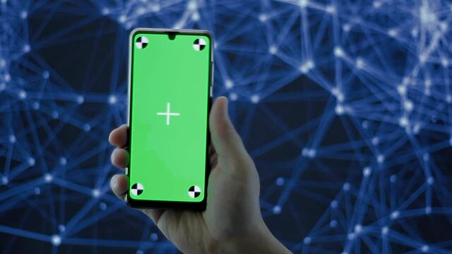 Mobil con croma key para ser usado en grafica promocional. Fondo de tecnolog&iacute;a
