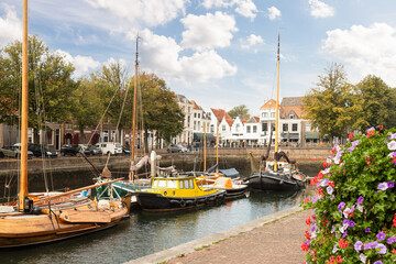 Old sailing ships in the harbor of the picturesque town of Zierikzee in the province of Zeeland,...