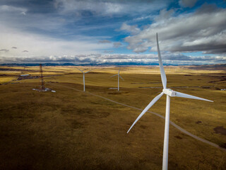 Windmill looking over the prairies towards the Rocky Mountains. 