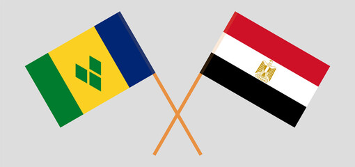 Crossed flags of Saint Vincent and the Grenadines and Egypt. Official colors. Correct proportion