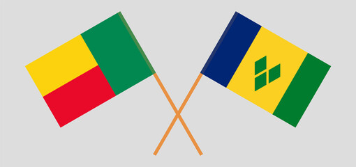 Crossed flags of Benin and Saint Vincent and the Grenadines. Official colors. Correct proportion