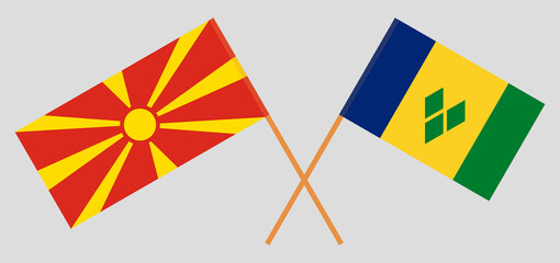 Crossed flags of North Macedonia and Saint Vincent and the Grenadines. Official colors. Correct proportion