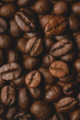 Coffee beans roasted full frame background Close up macro dark brown