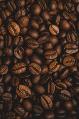 Coffee beans roasted full frame background Close up macro dark brown