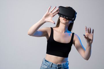 Happy brunette girl getting experience using VR headset glasses of virtual reality.