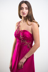 Fototapeta premium Beautiful woman long evening dress on white background