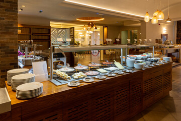 Breakfast served on a buffet table in a hotel restaurant