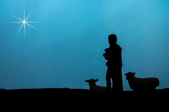 shepherd sheep silouette with the star of Bethlehem