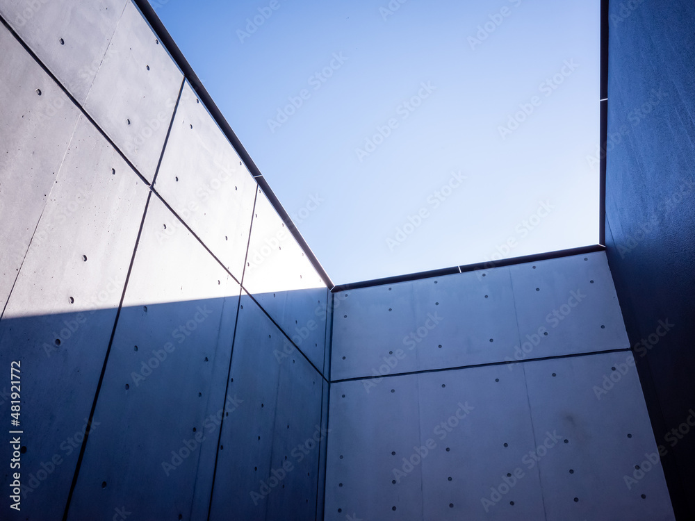 Wall mural blue sky surrounded by inorganic concrete walls in japan