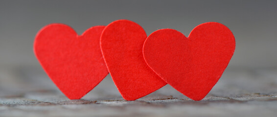 Obraz premium White and red heart on a wooden background.