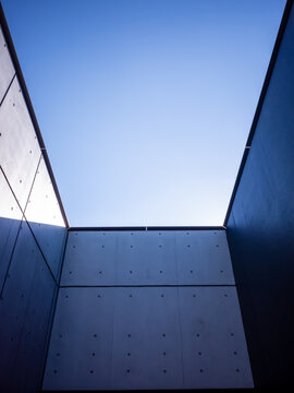blue sky surrounded by inorganic concrete walls in japan